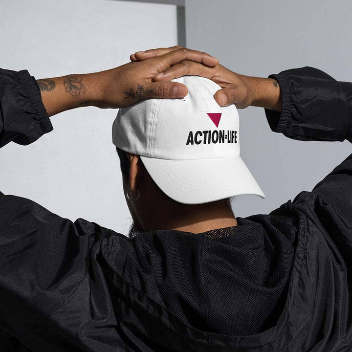 Man from the behind with a white cap featuring &