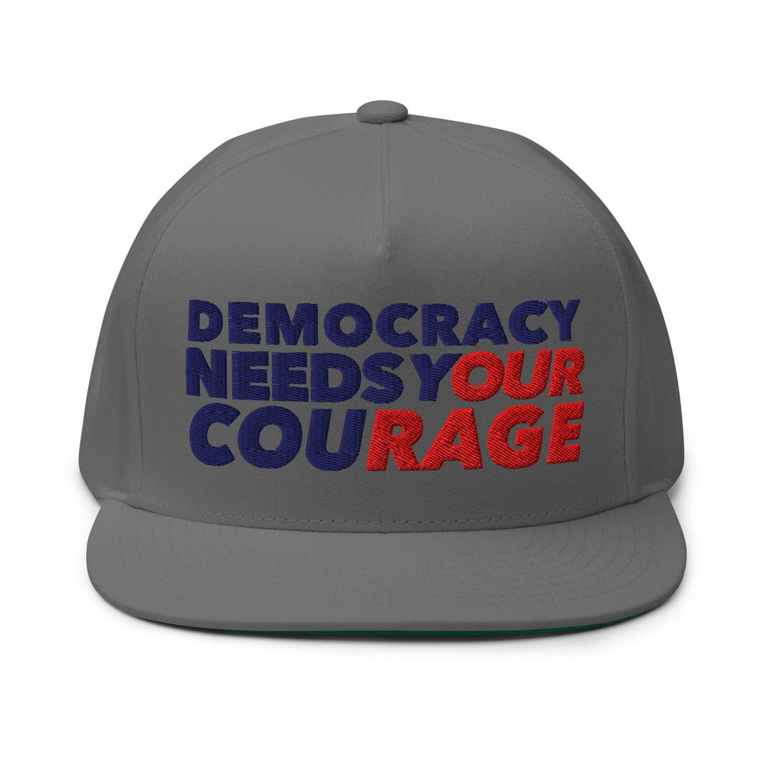 Gray cap with 'Democracy Needs Your Courage' text in blue and red on a white background
