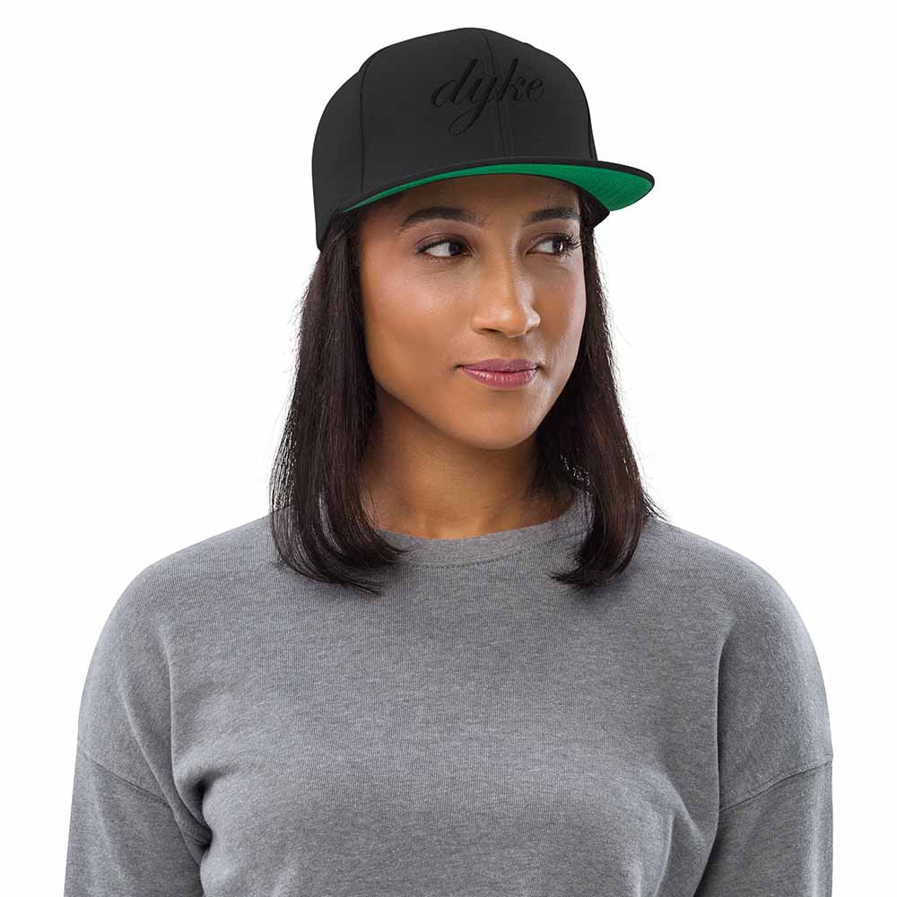 Black-on-Black Dyke 6 Panel Flatbill Snapback Hat on woman