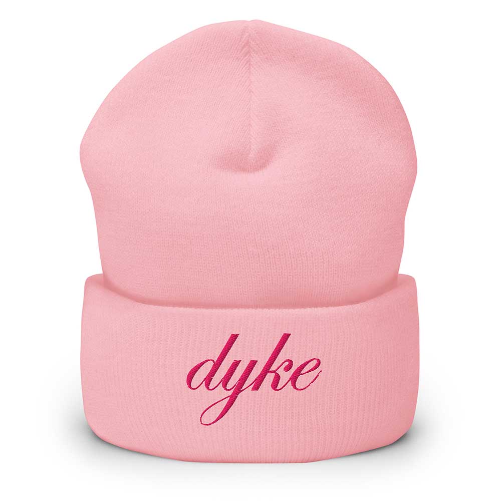 Pink beanie with 'dyke' embroidered on a white background