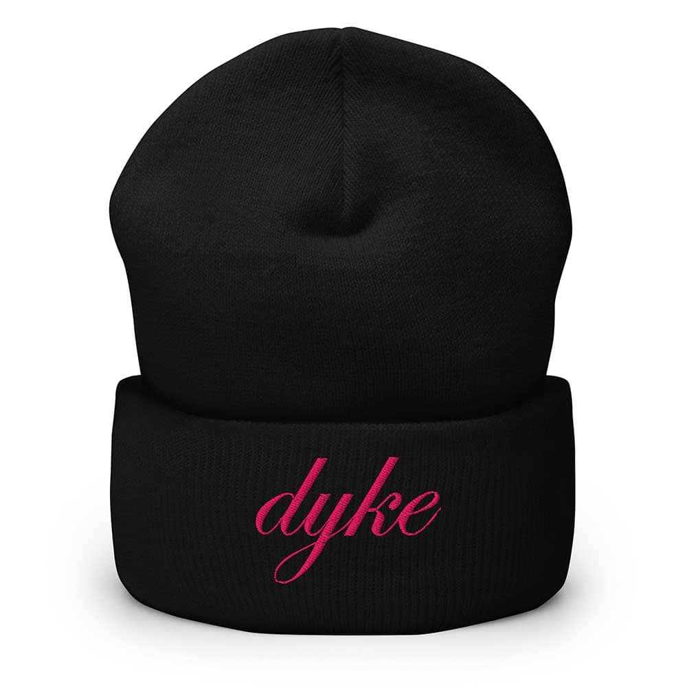 Black beanie with pink 'dyke' text on a white background