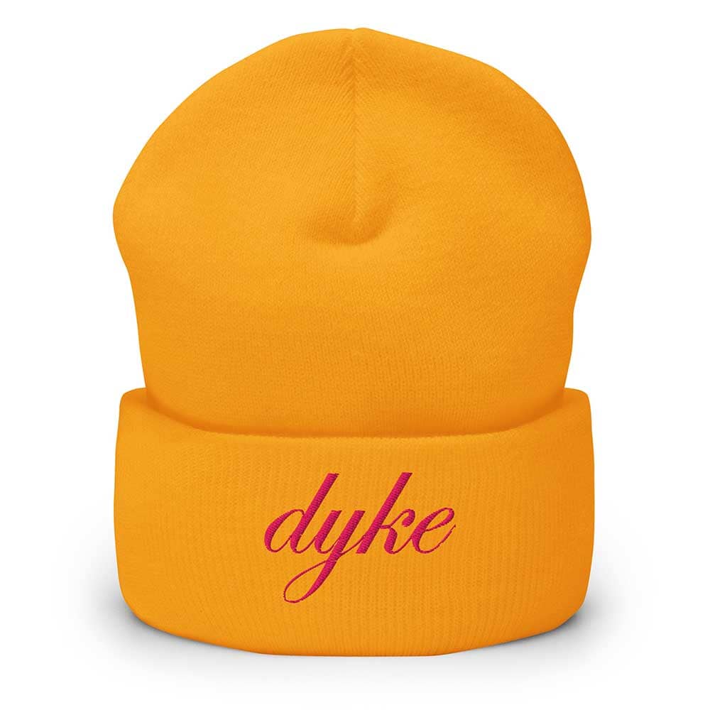 Golden yellow beanie with 'dyke' in pink text on a white background