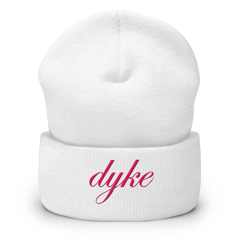 White beanie with pink 'dyke' text on a white background