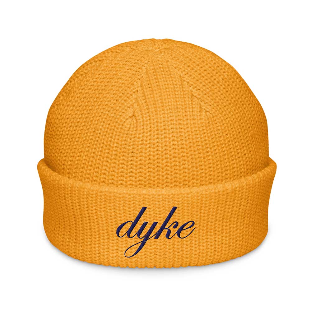 golden yellow beanie with 'dyke' text on a white background