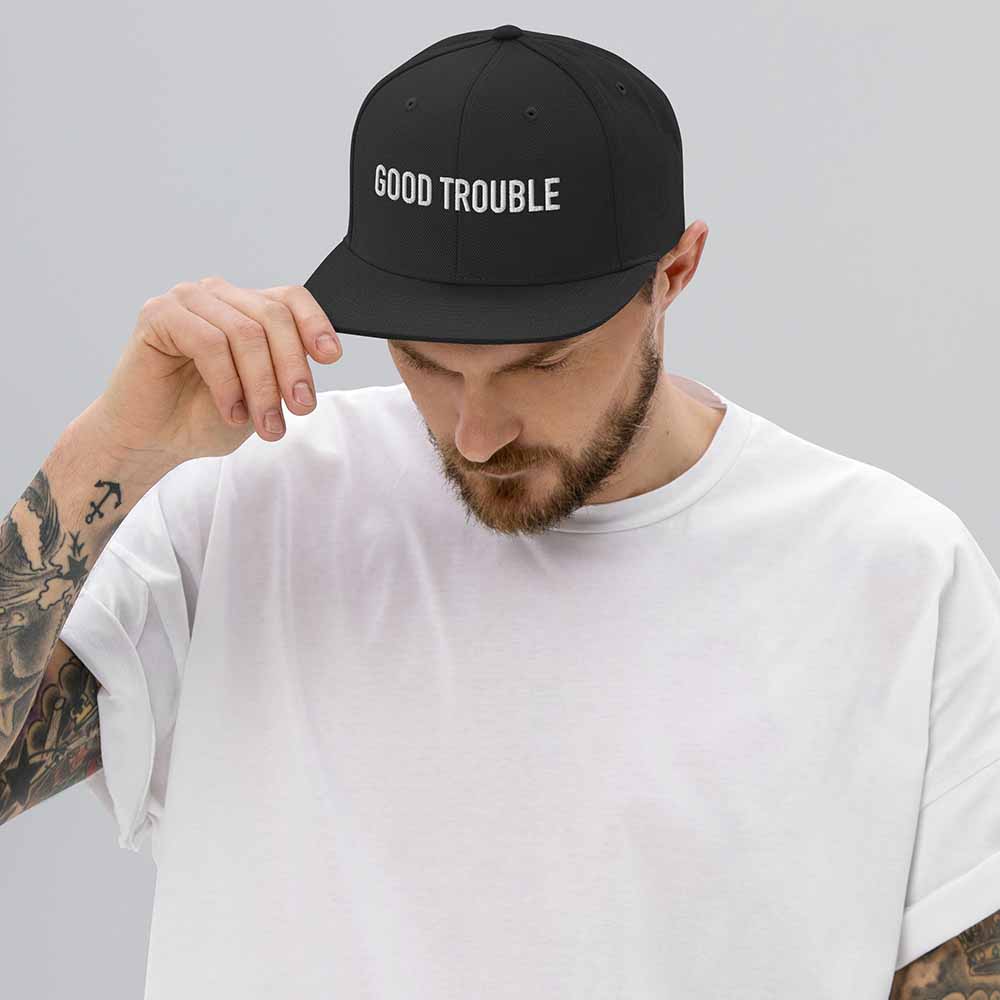 GOOD TROUBLE Flatbill 6-Panel Snapback Hat black on man