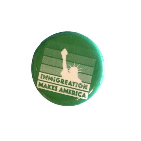 Green button with 'Immigration Makes America' text and a graphic of the Statue of Liberty on a white background