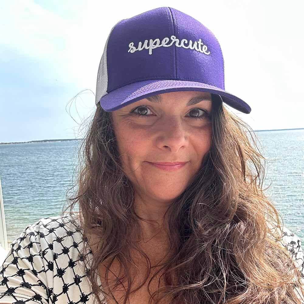 women wearing purple supercute snapack hat