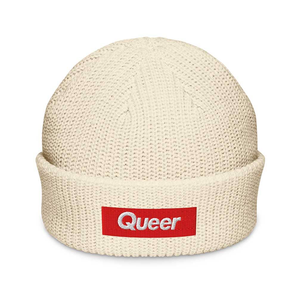 IVORY knit beanie with a red 'Queer' logo patch on a white background