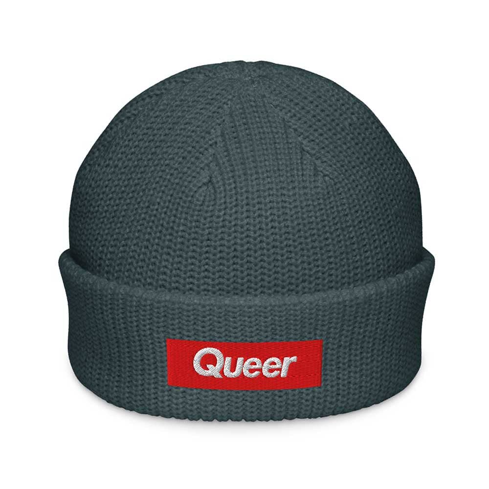 Petrol Blue beanie with a red 'Queer' logo on a white background