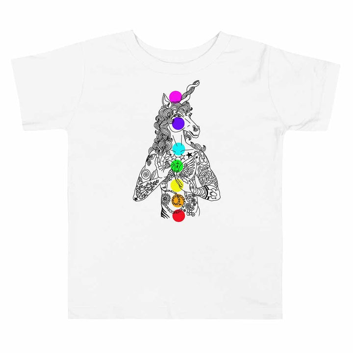 White t-shirt with a unicorn design featuring colorful gemstones on a white background