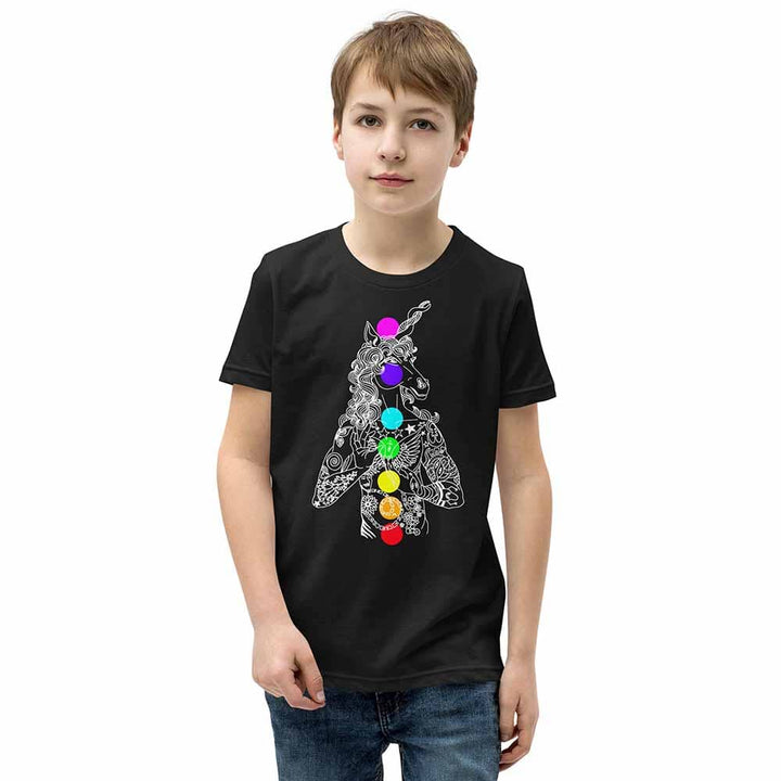 Child wearing a black t-shirt with a colorful unicorn design on a white background