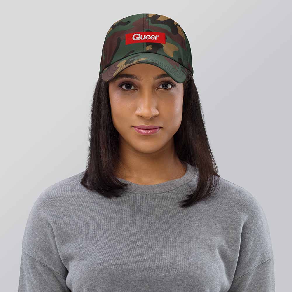 queer camo twill dad hat on woman