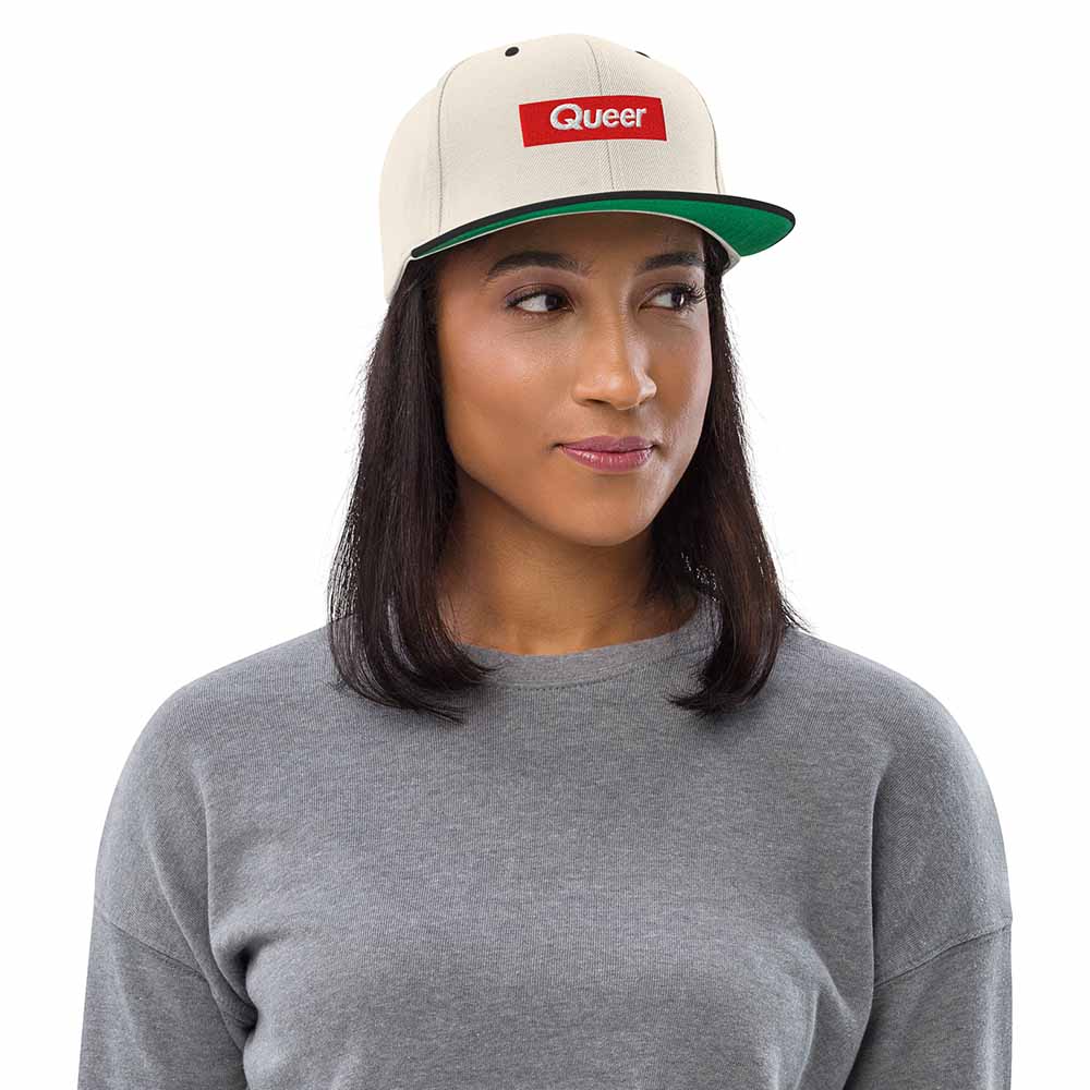 Queer Flatbill 6-Panel Snapback Hat ivory and black on woman