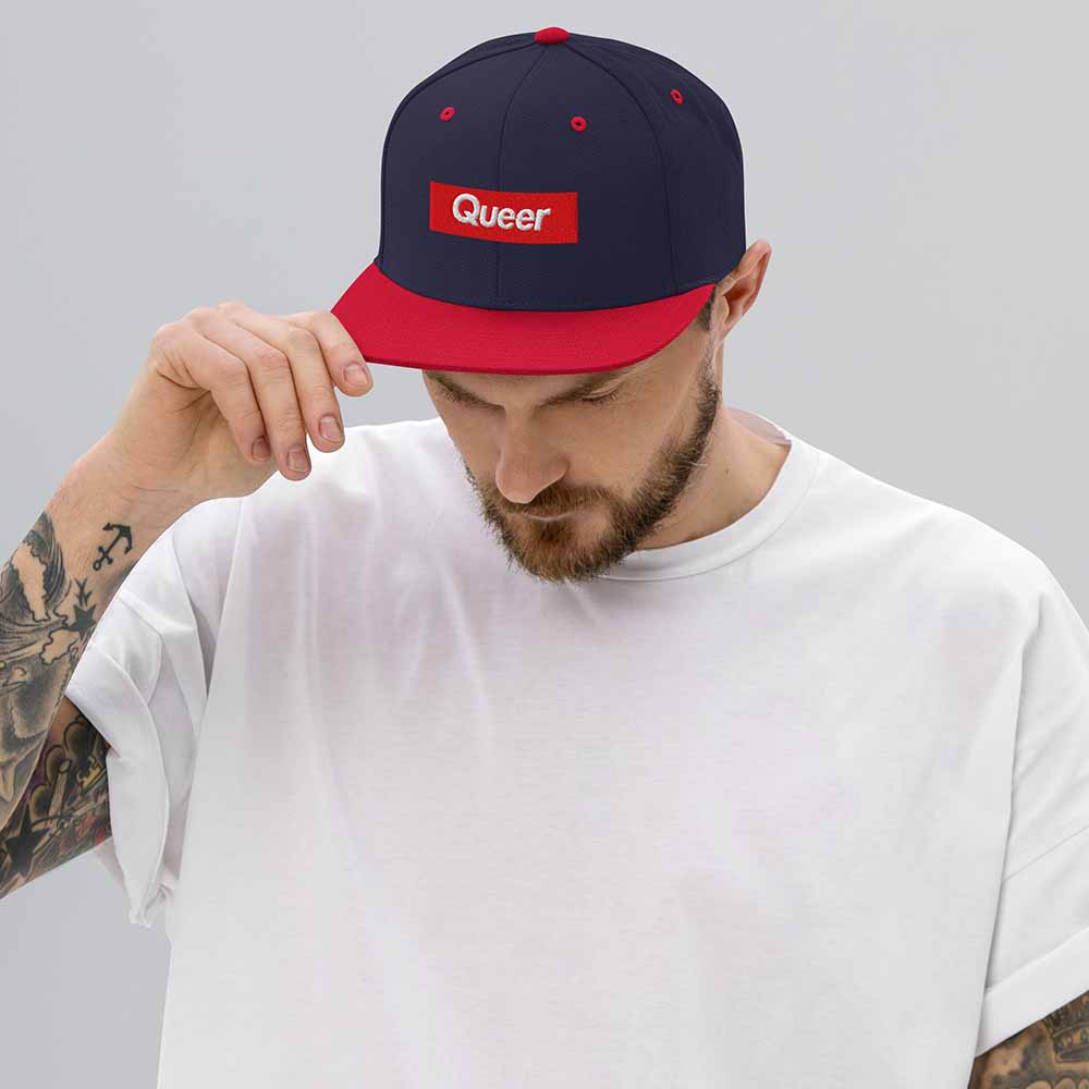 Queer Flatbill 6-Panel Snapback Hat ivory and black navy red on man