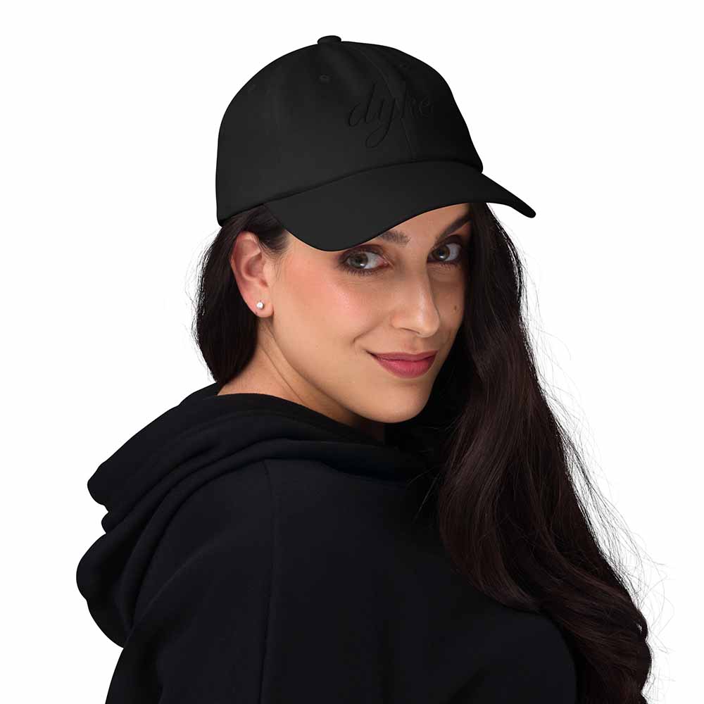 Black-on-black Dyke Twill Dad Hat on woman