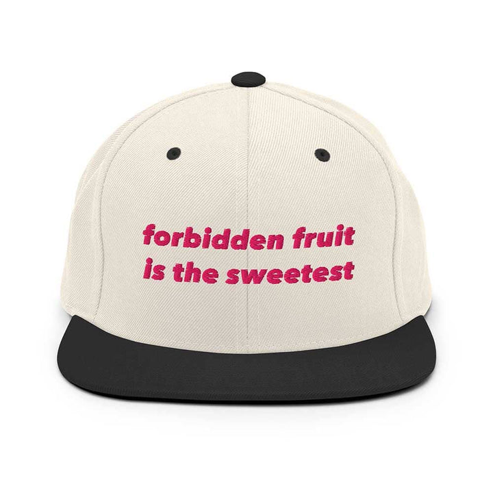 natural black flatbill cap with black brim and pink "forbidden fruit is the sweetest" text on a white background