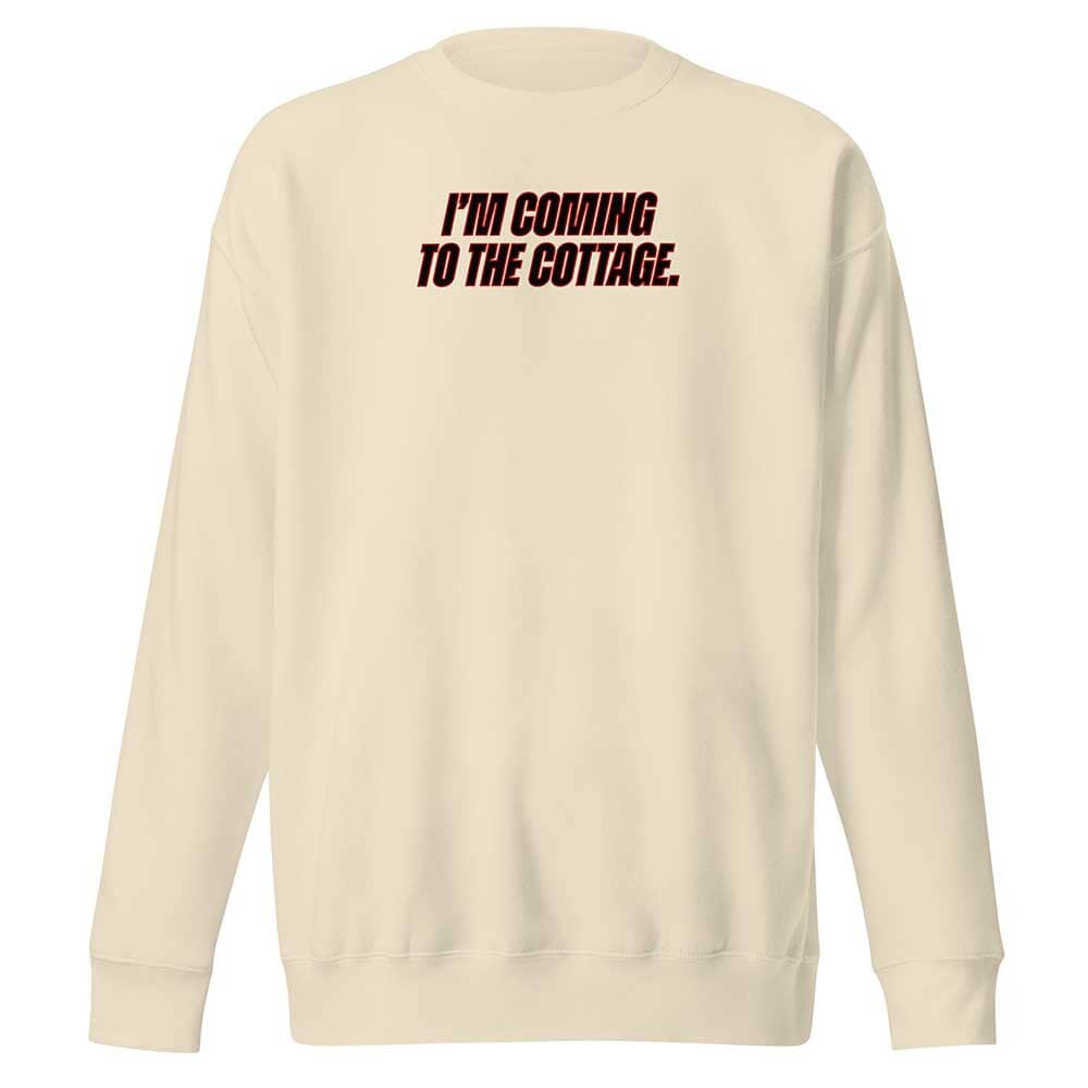 Beige sweatshirt with text 'I'm coming to the cottage' on the back against a white background