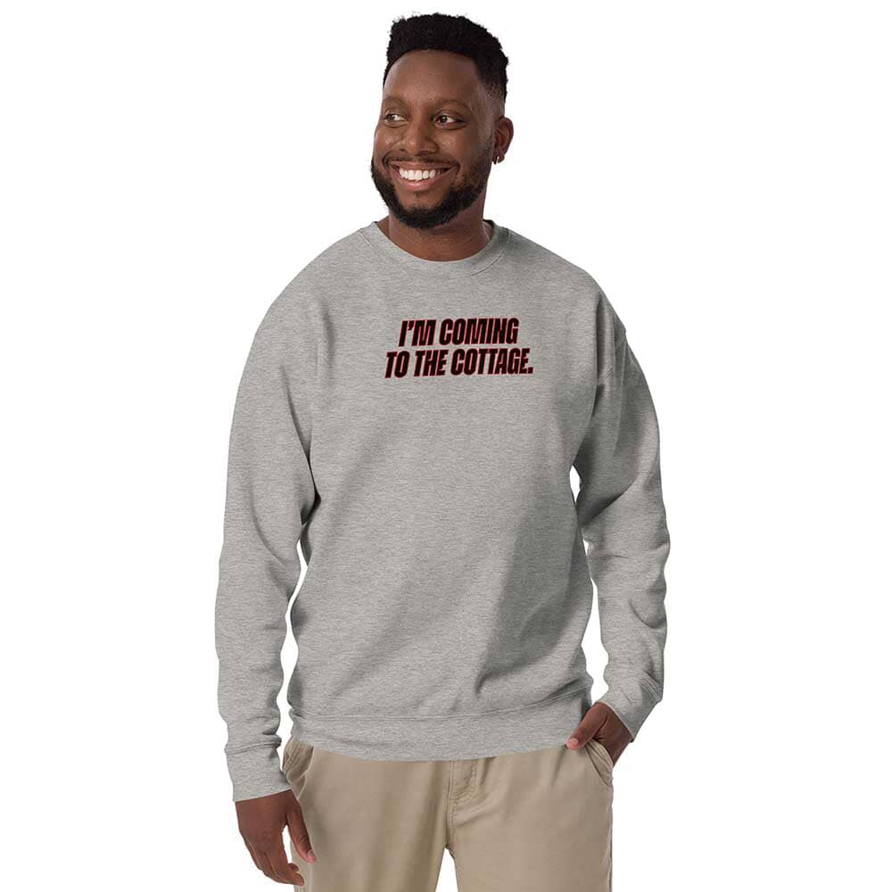 Person wearing a gray sweatshirt with text on a white background