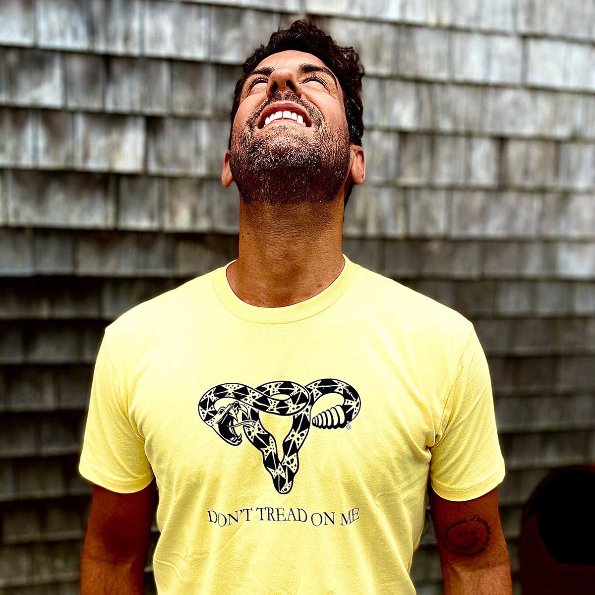 A customer in the yellow Don't Tread On Me tee