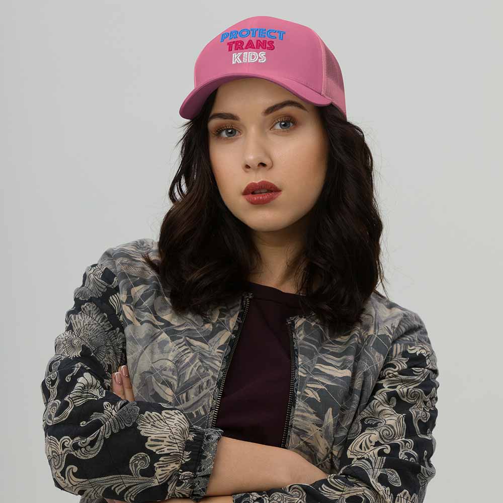 Protect Trans Kids Trucker Mesh Snapback Hat pink on woman