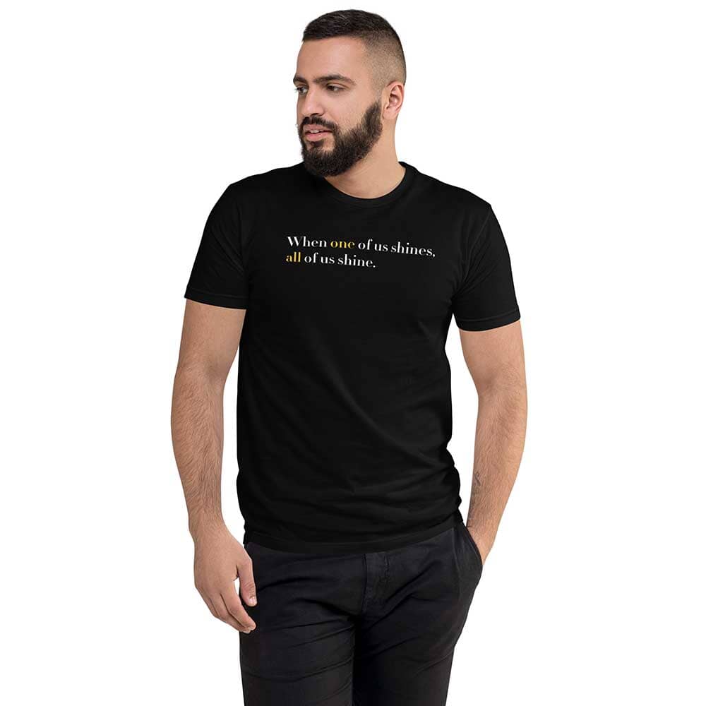 Man wearing a black t-shirt with a motivational quote on a white background