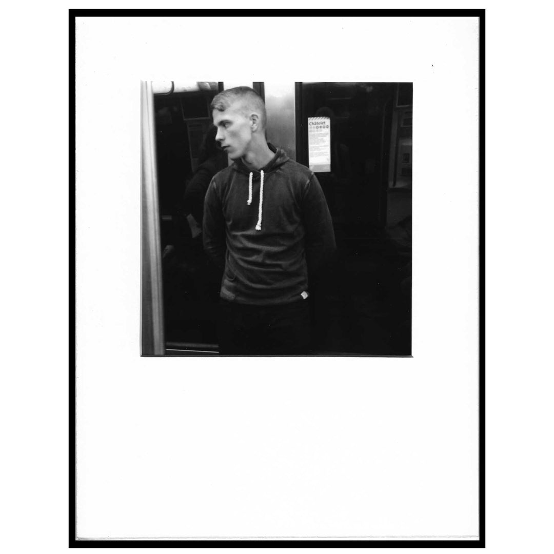 black and white photo of man in hoodie